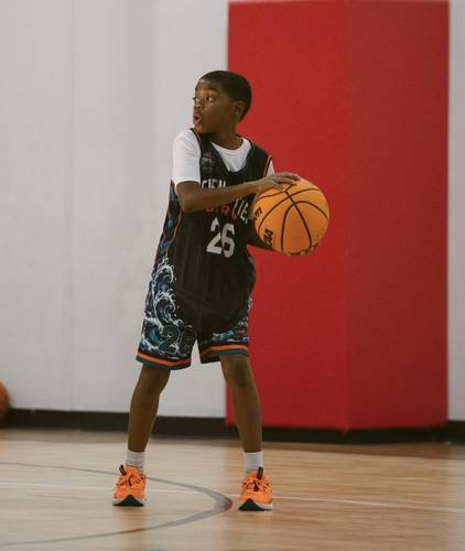 Surge player in uniform handling the ball