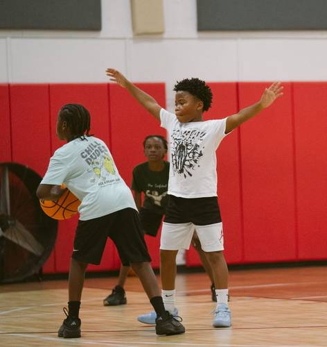 Surge player playing defense with arms up